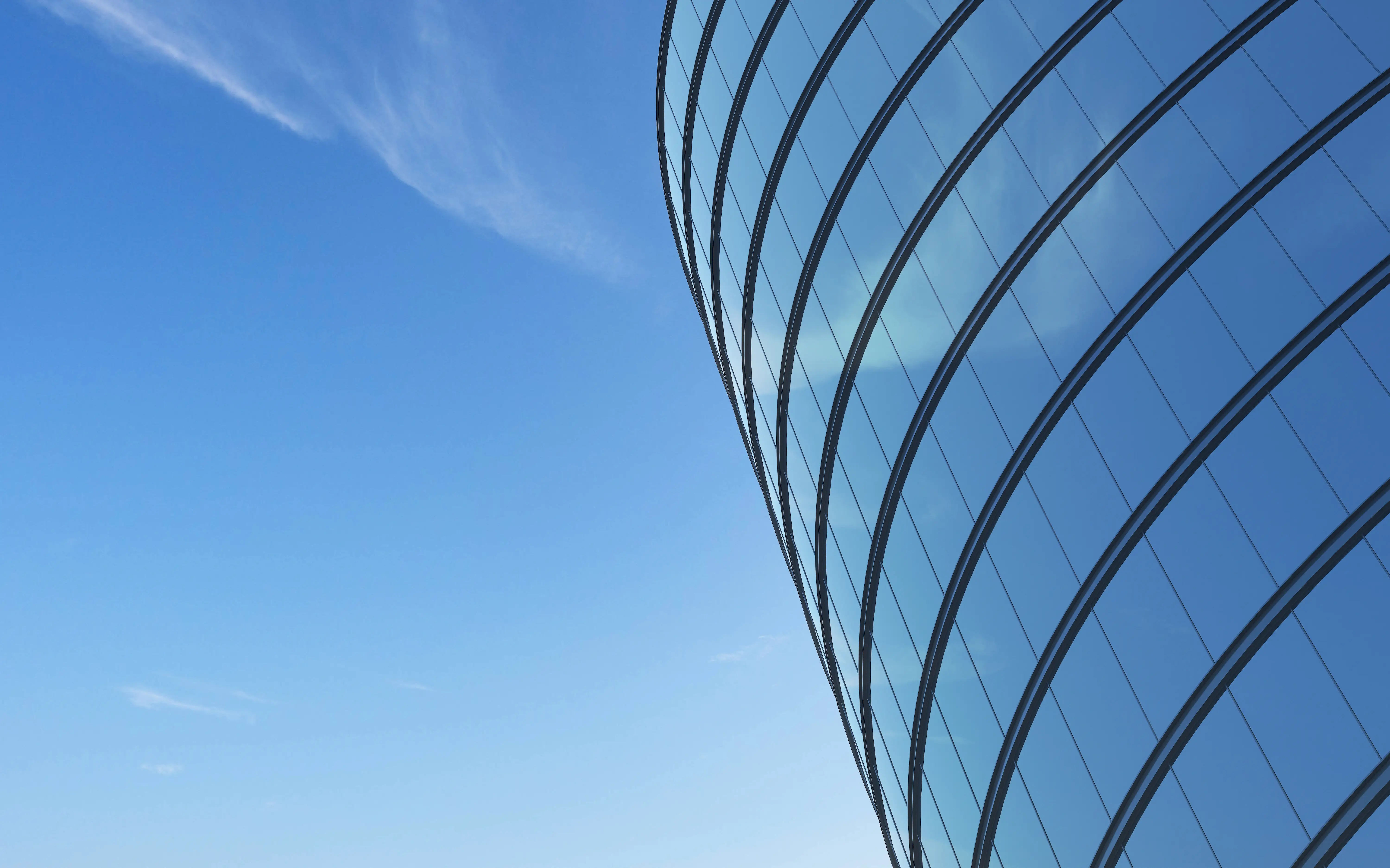 Curved glass facade of a completed Awadvi TriCore scheme
